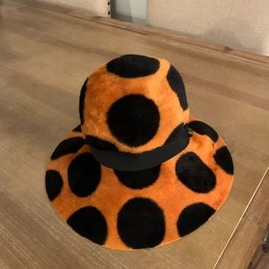 Vintage Mr John’s black and orange spotted hat.
